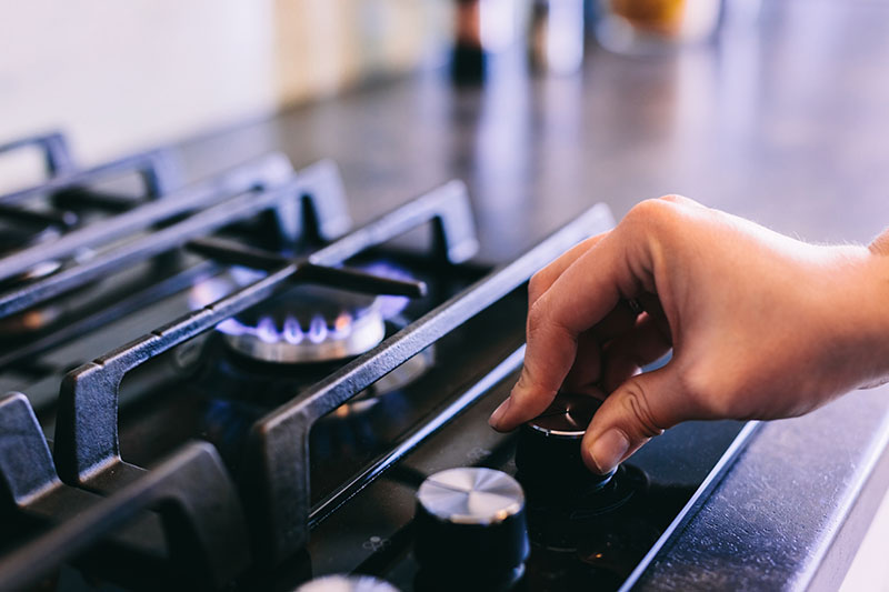 Turning on a propane stove